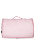 pink mesh back of pink and white striped packing cube on a white background