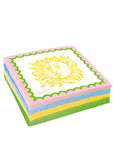 Stack of colorful napkins with a sun design on a white background
