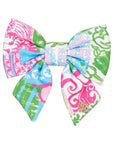 Colorful patterned hair bow on a white background