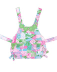Colorful patchwork dress with floral and geometric patterns on a white background