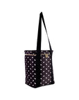Black tote bag with white polka dots on a white background