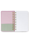 Notebook with pink and green striped design on a white background