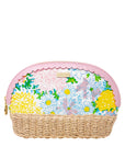 Floral-patterned pouch with a wicker base on a white background