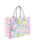 Floral tote bag with ruffled edge on a white background