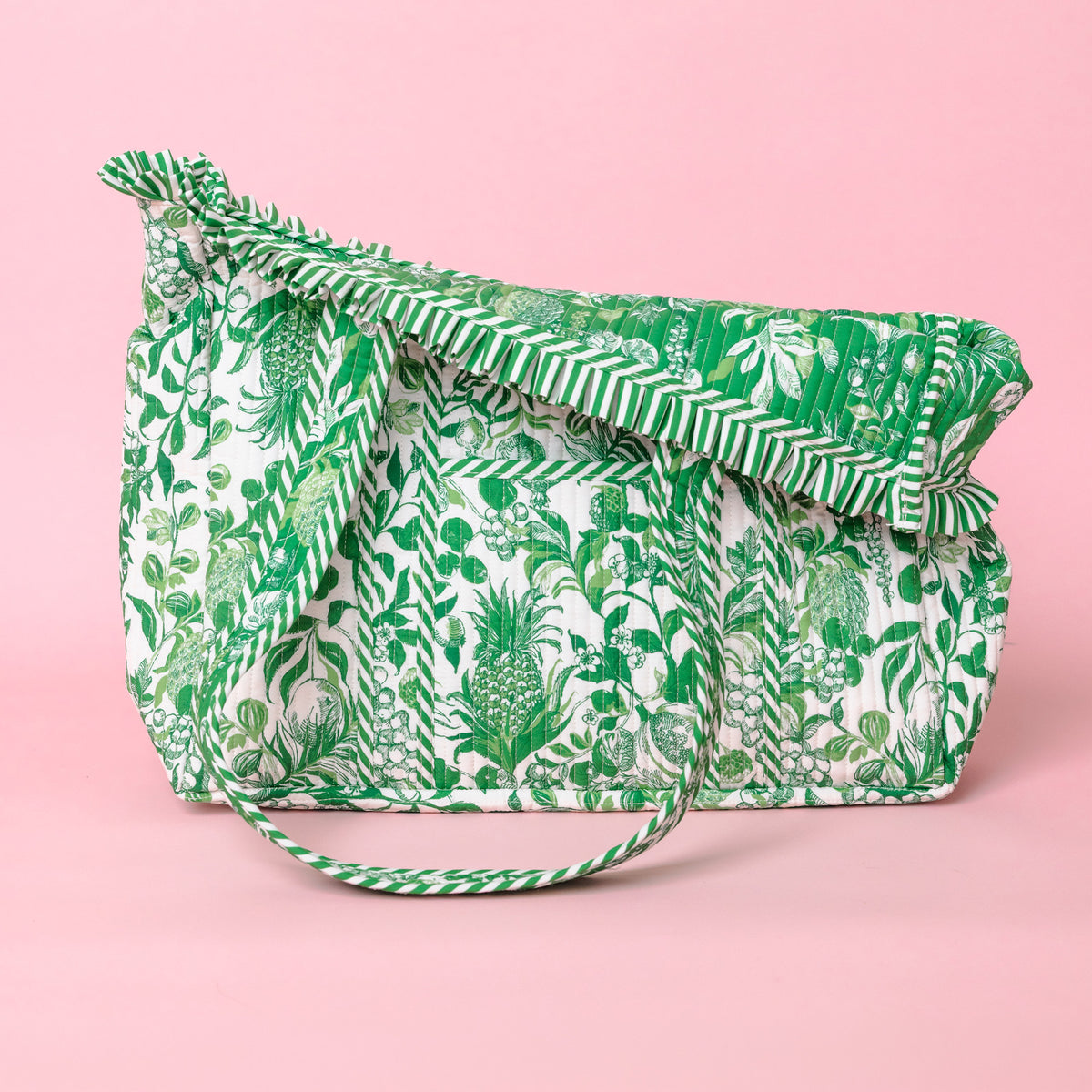folded down green and white tropical botanical print tote bag with ruffled trim and long shoulder straps