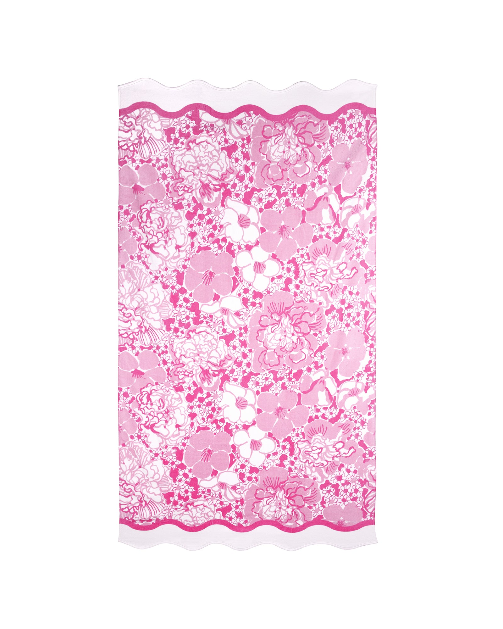 Pink floral beach towel with scalloped edge on a white background