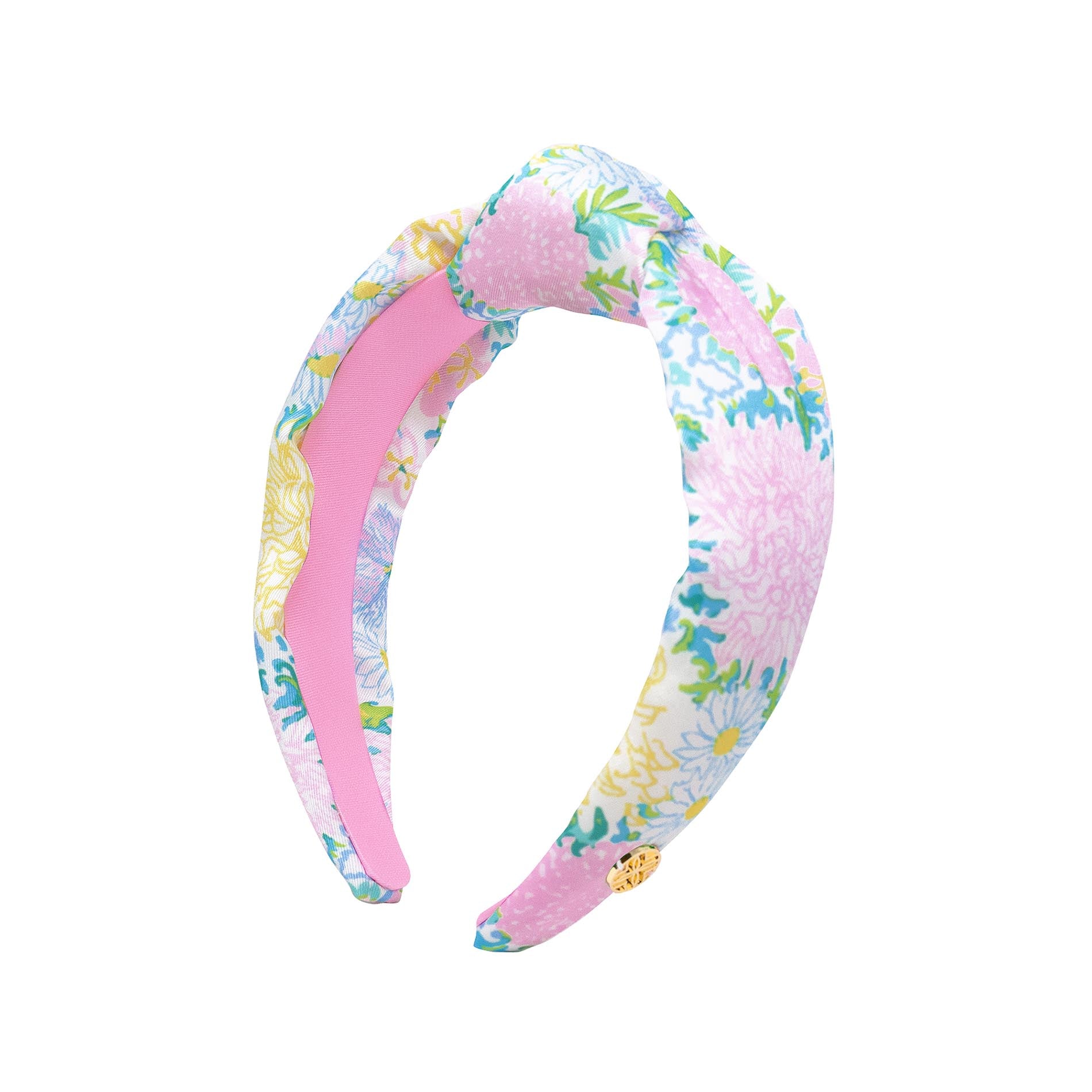 Floral patterned headband with pink center on a white background
