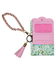 Floral patterned wallet with pink interior, gold chain, and tassel on a white background