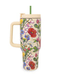 Colorful floral-patterned tumbler with a handle on a white background