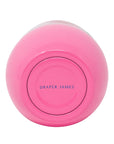 Pink container with 'Draper James' branding on a white background