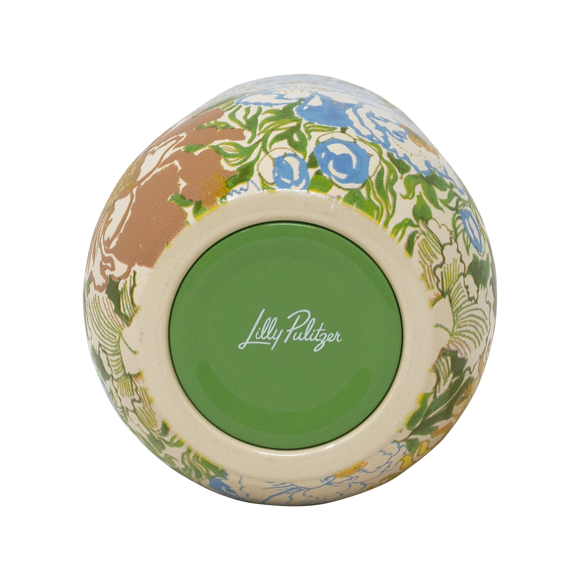 Top-down view of a ceramic bowl with a colorful floral and botanical pattern on a cream base, featuring a solid green center with the white script logo 'Lilly Pilitzer'.