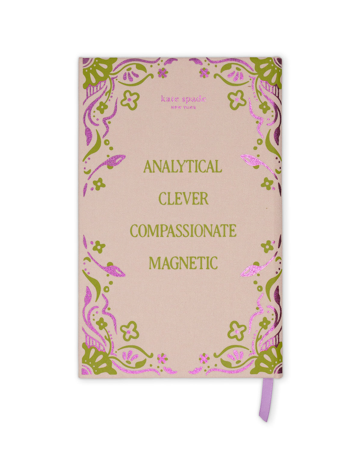 A pink notebook with a decorative border and gold text reading 'ANALYTICAL CLEVER COMPASSIONATE MAGNETIC' on the cover, with a purple ribbon bookmark hanging from the bottom right.