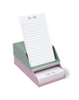 Striped to-do list pad with pink holder on a white background