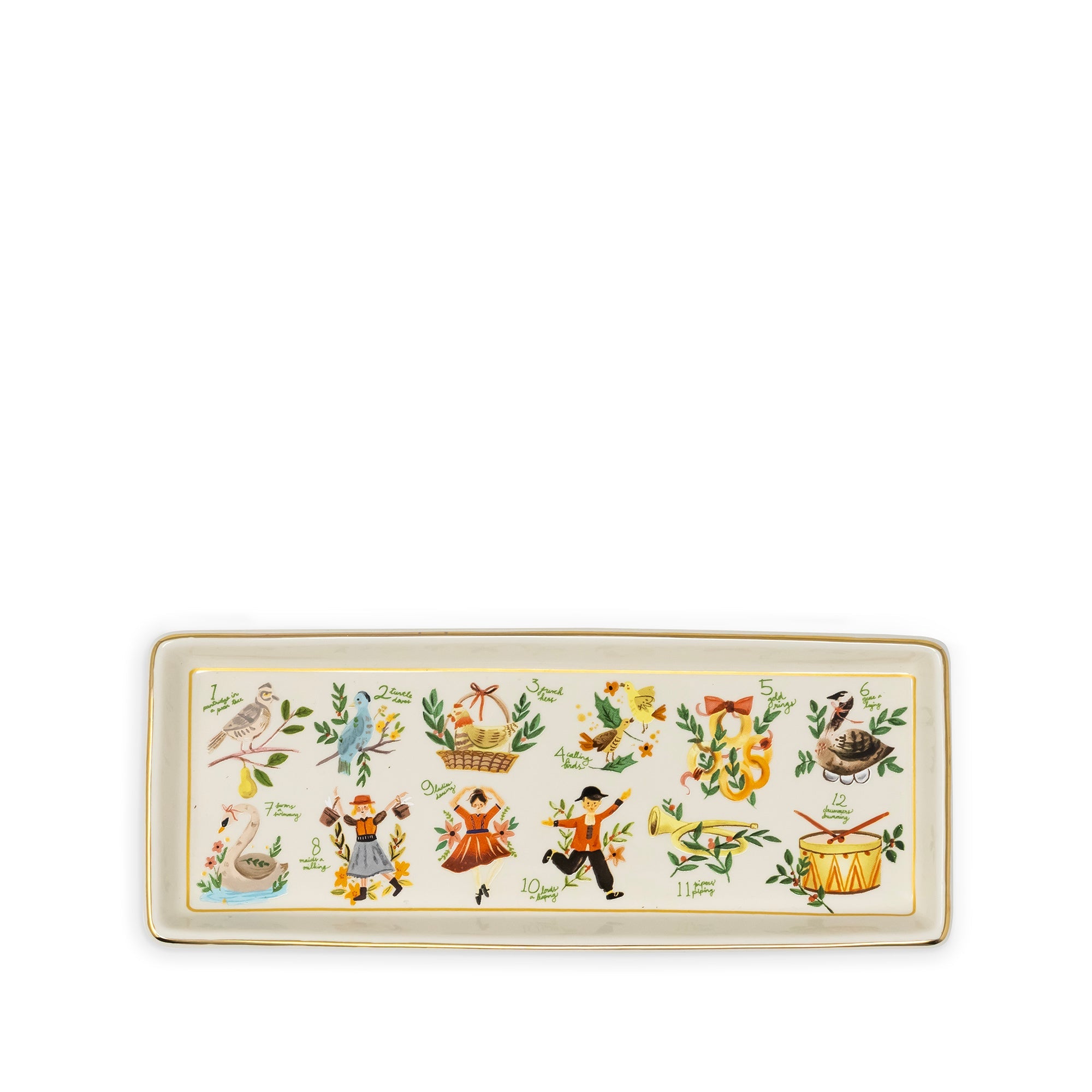 A rectangular ceramic tray with a cream-colored background, featuring a row of colorful illustrated motifs including birds, a basket, a figure in a dress, a flower, and a drum, bordered in gold.