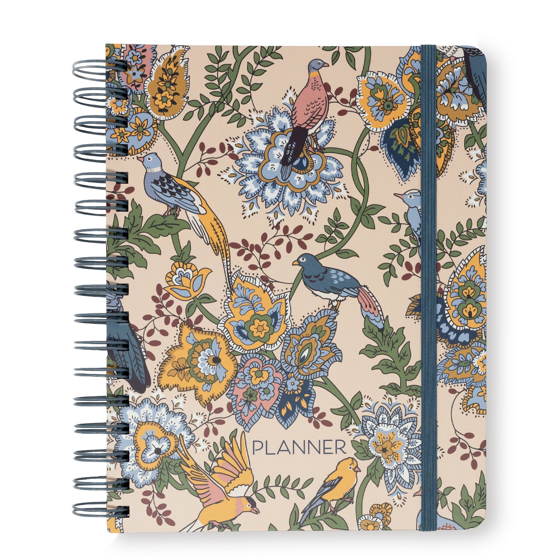 A spiral-bound planner with a beige cover decorated with an intricate vintage-style floral and bird pattern in blue, yellow, green, and pink. The word 'PLANNER' is printed near the bottom center.