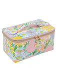 Floral patterned makeup bag with pink accents on a white background