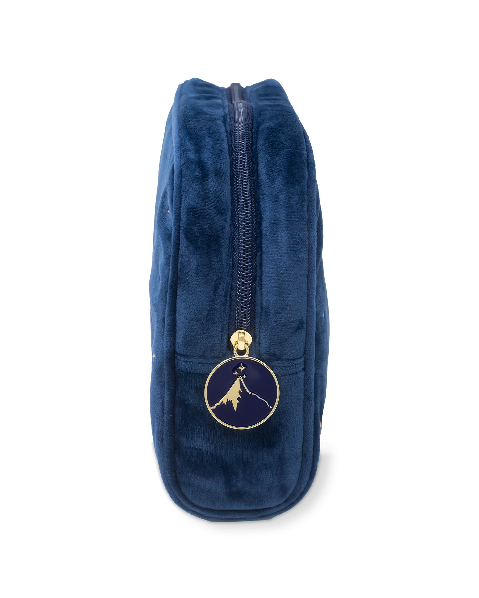Blue velvet pouch with a gold zipper and emblem on a white background