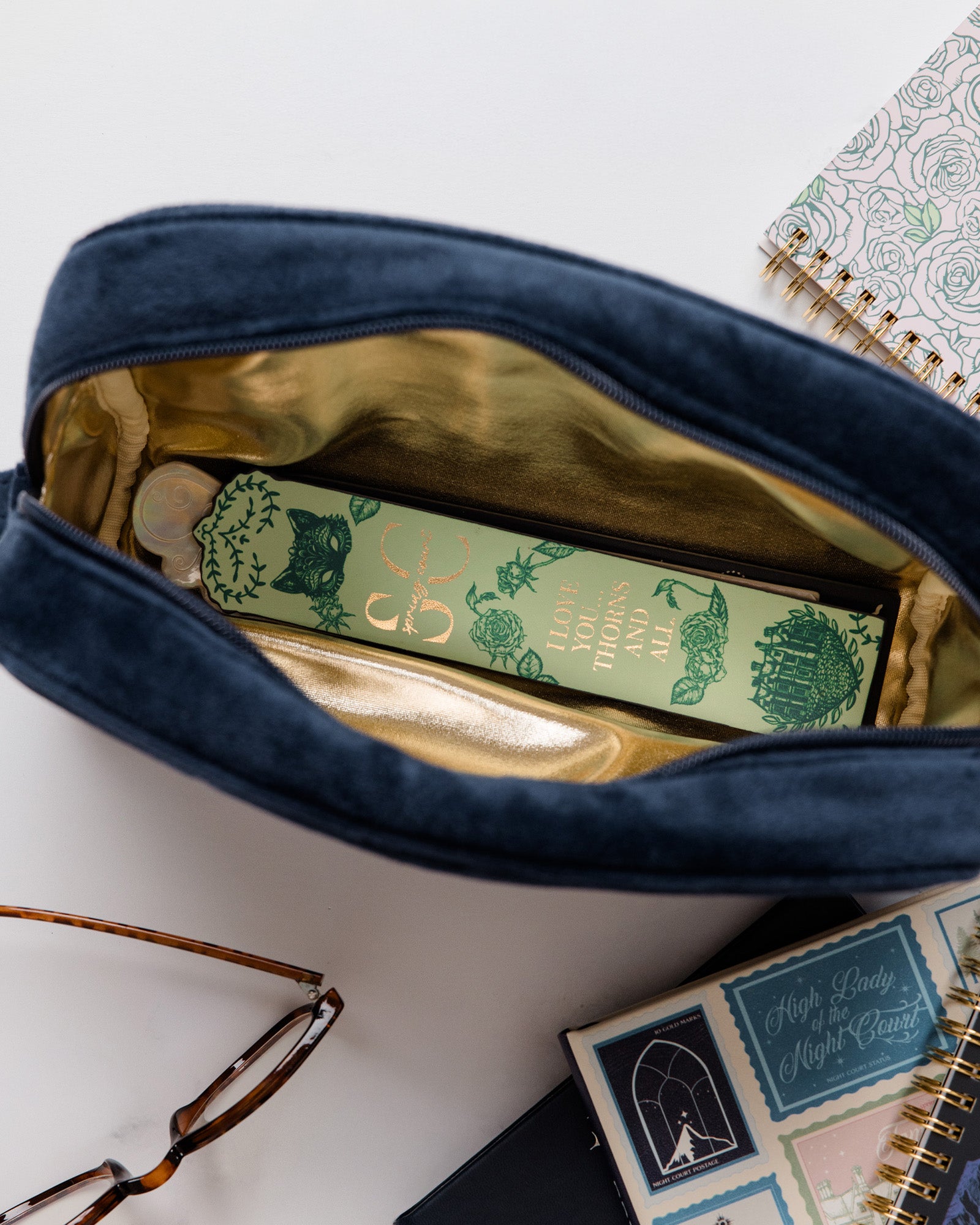 gold interior of blue velvet pouch