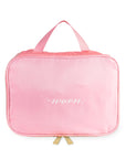 Pink travel bag with 'worn.' text on a white background