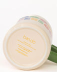 Mug with colorful design and 'ban.do' branding on a white background