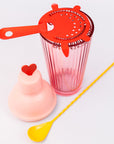 Bar set with pink shaker, red strainer and yellow heart stir spoon