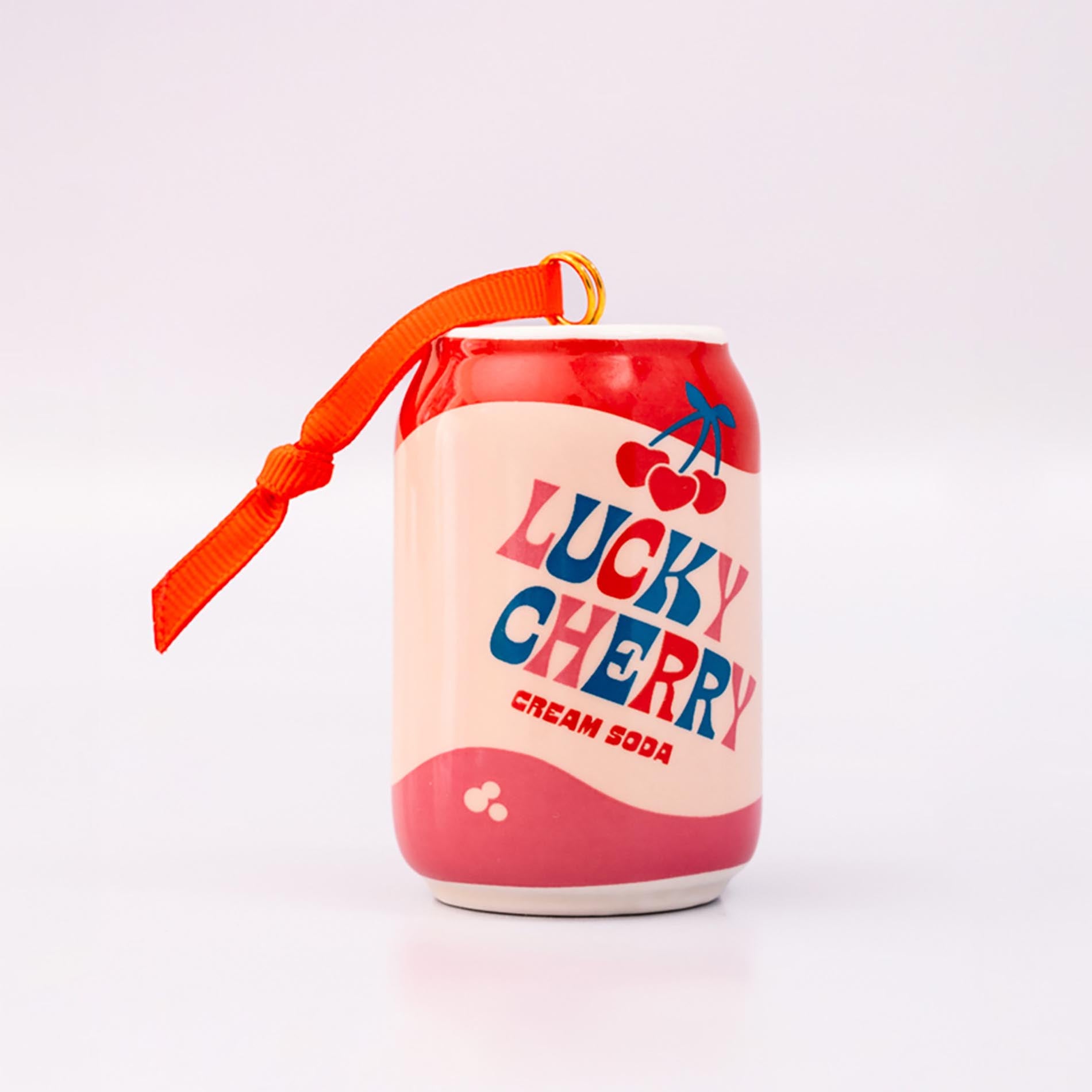 Lucky cherry cream soda with ornament on a white background