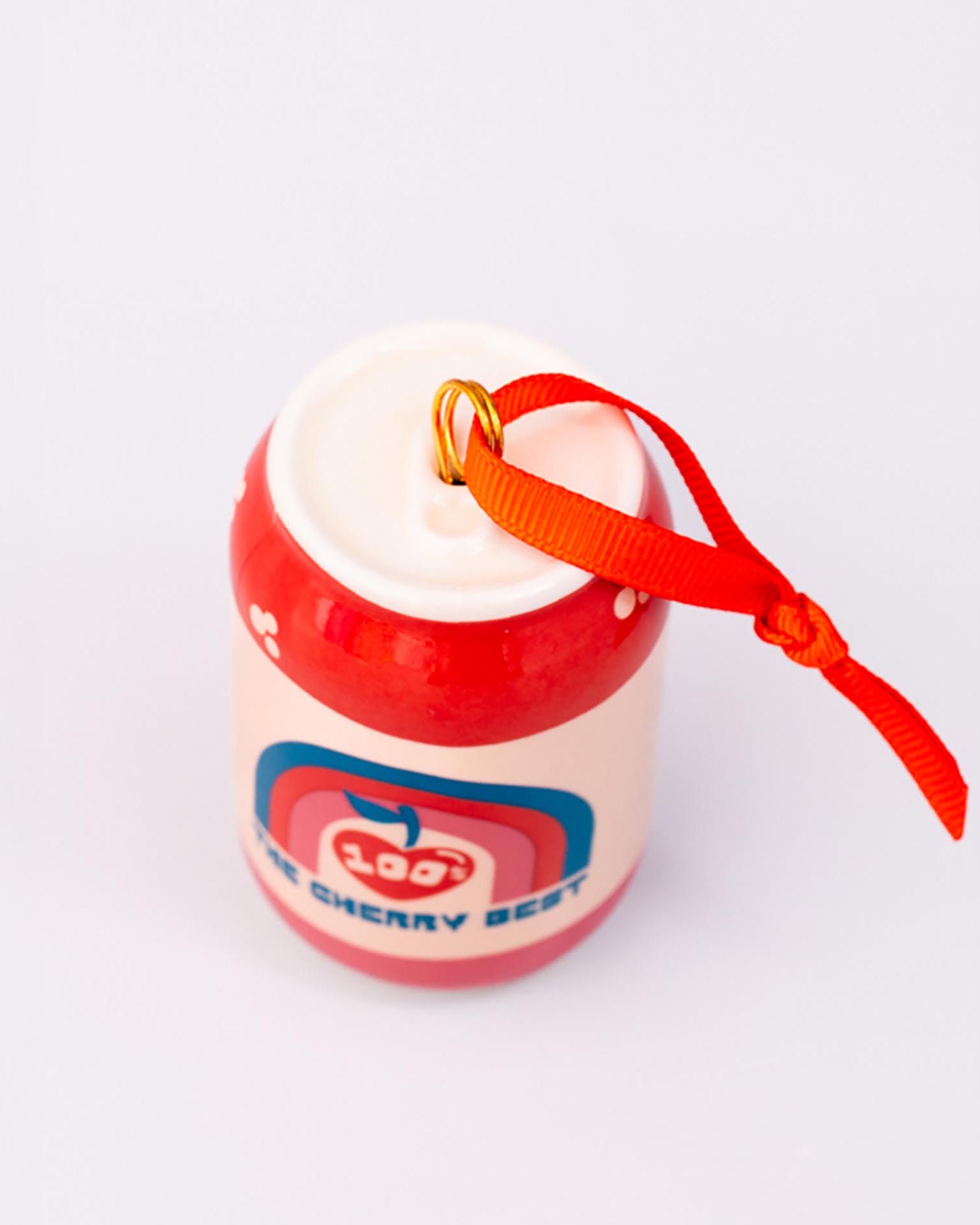 Top view of lucky cherry cream soda with ornament on a white background