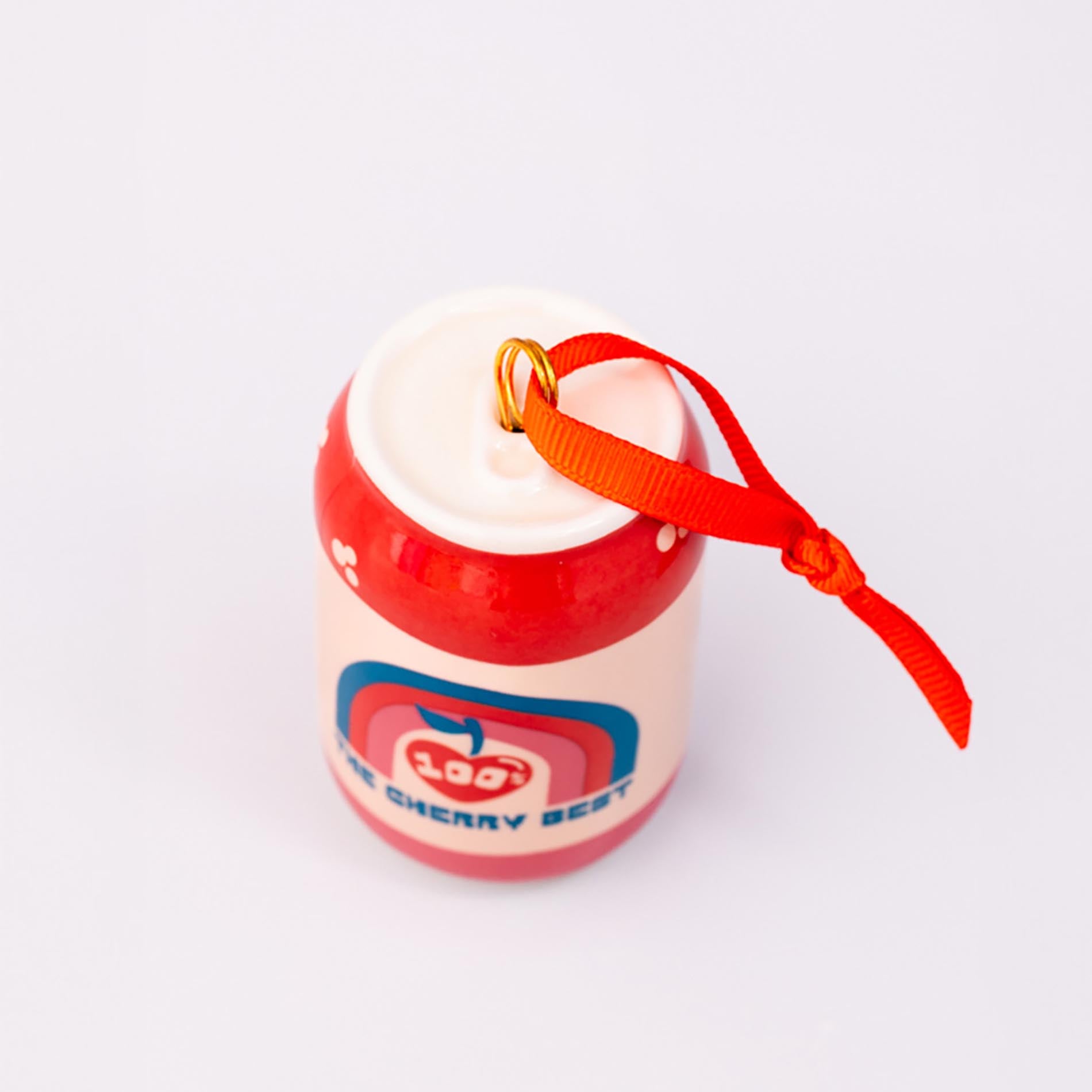 Top view of lucky cherry cream soda with ornament on a white background