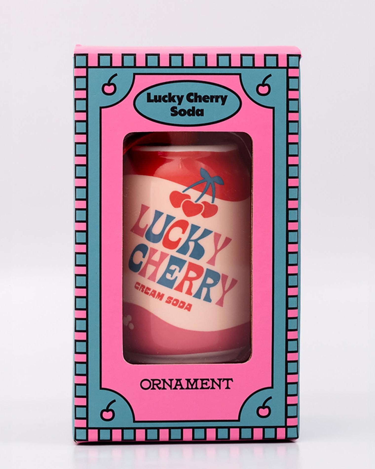 Packaged lucky cherry cream soda with ornament on a white background