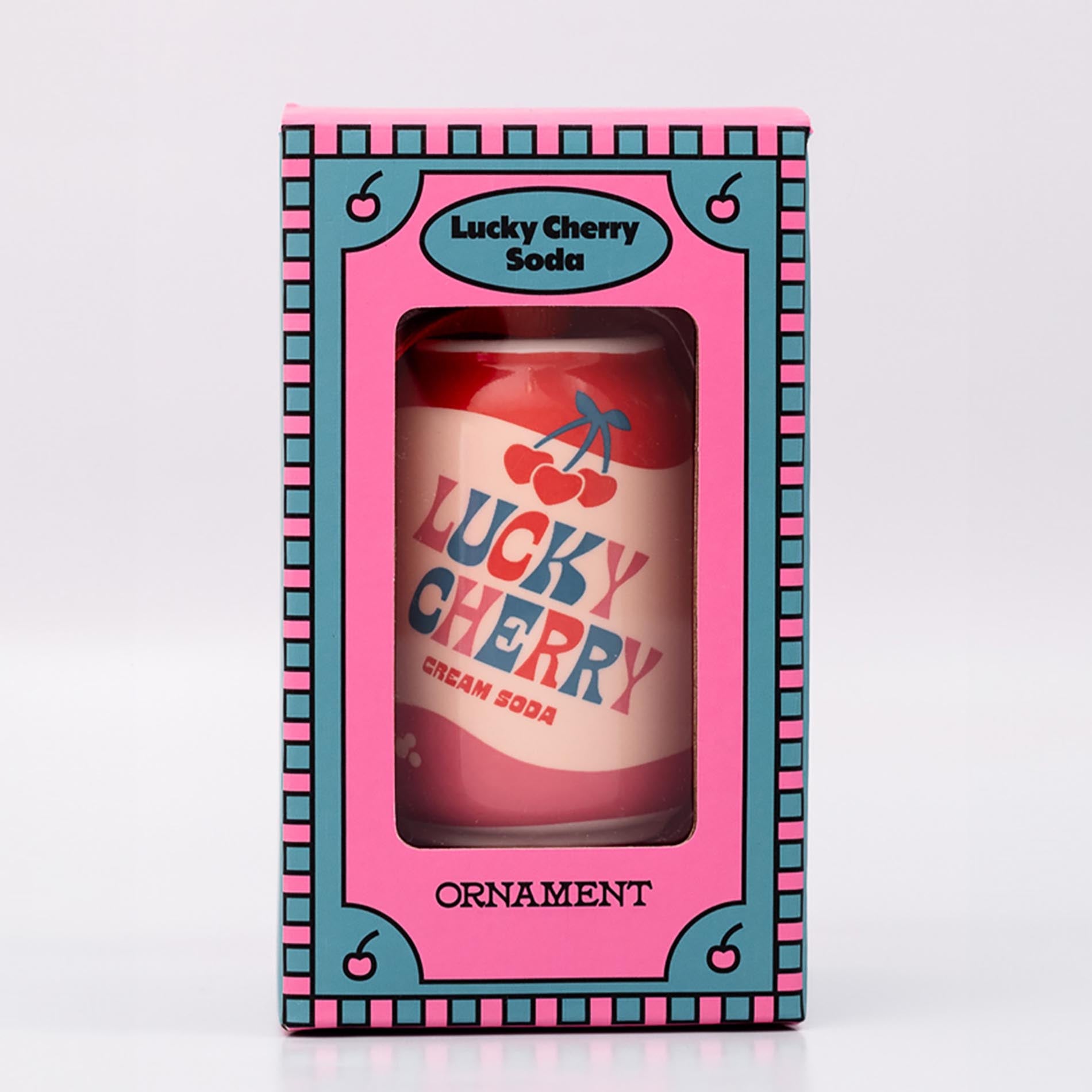 Packaged lucky cherry cream soda with ornament on a white background