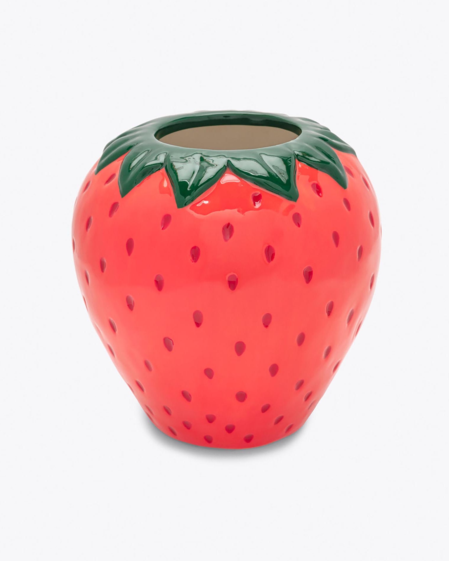 Ceramic strawberry-shaped container on a white background