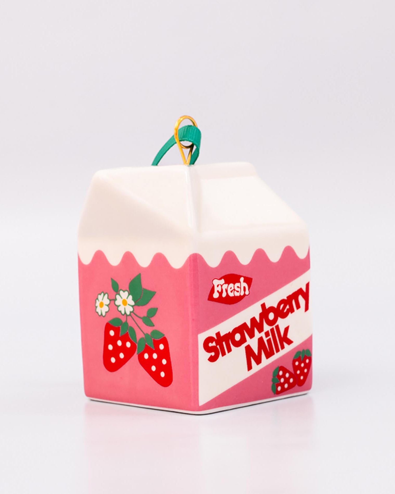 Strawberry milk carton-shaped ornament on a white background