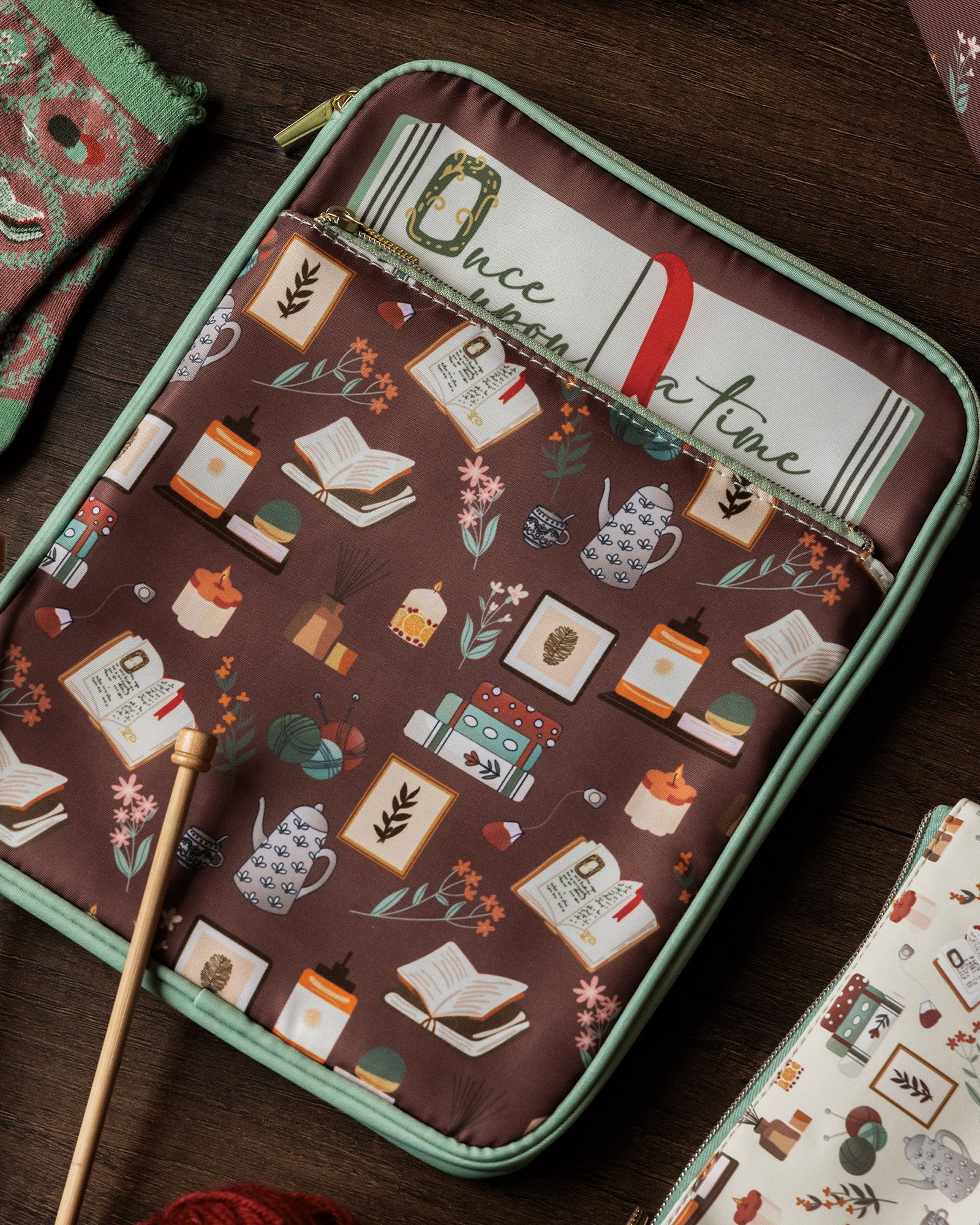 brown book sleeve with colorful cozy book nook icons on a table