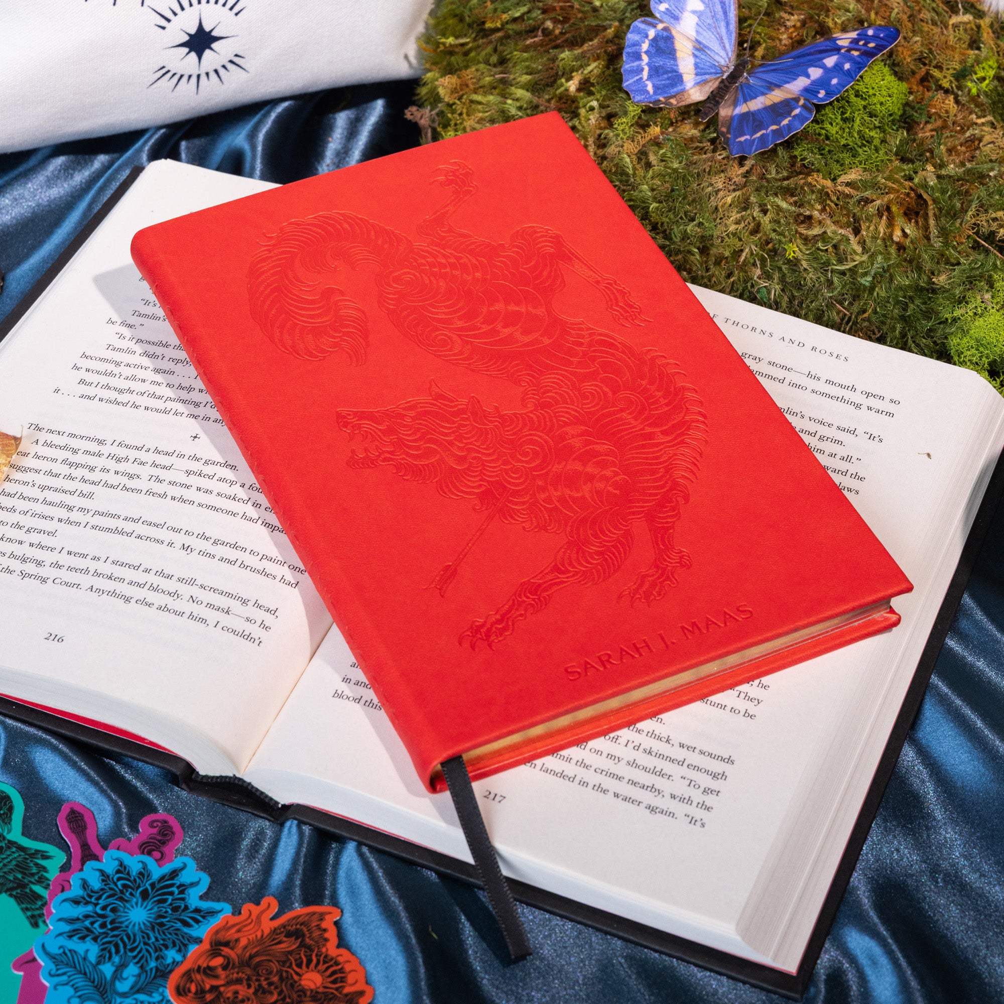 Red notebook with a wolf design on a blue background