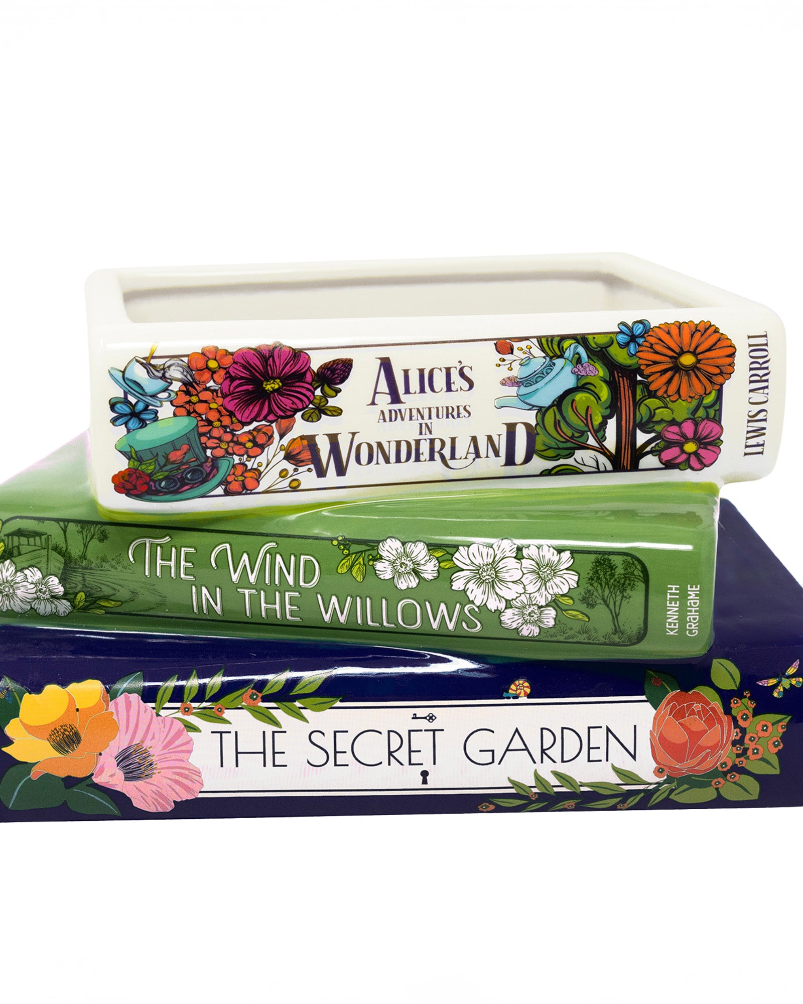 Stack of books with decorative covers on a white background