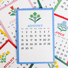 scattered months of 2027 colorful desk calendar with scandinavian folk floral print