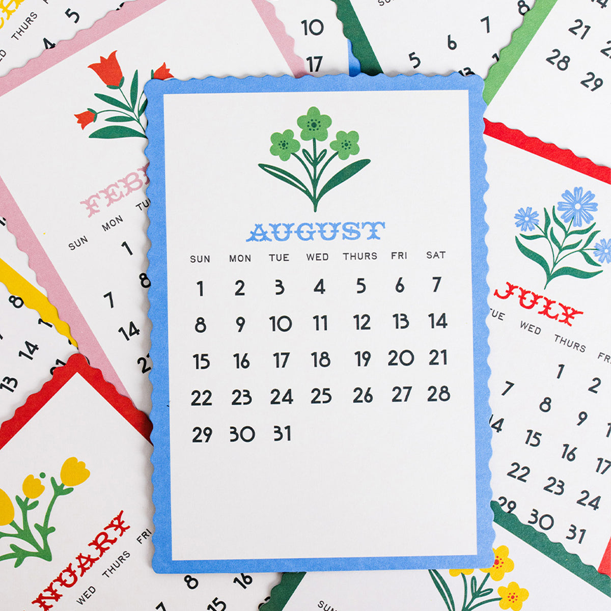scattered months of 2027 colorful desk calendar with scandinavian folk floral print