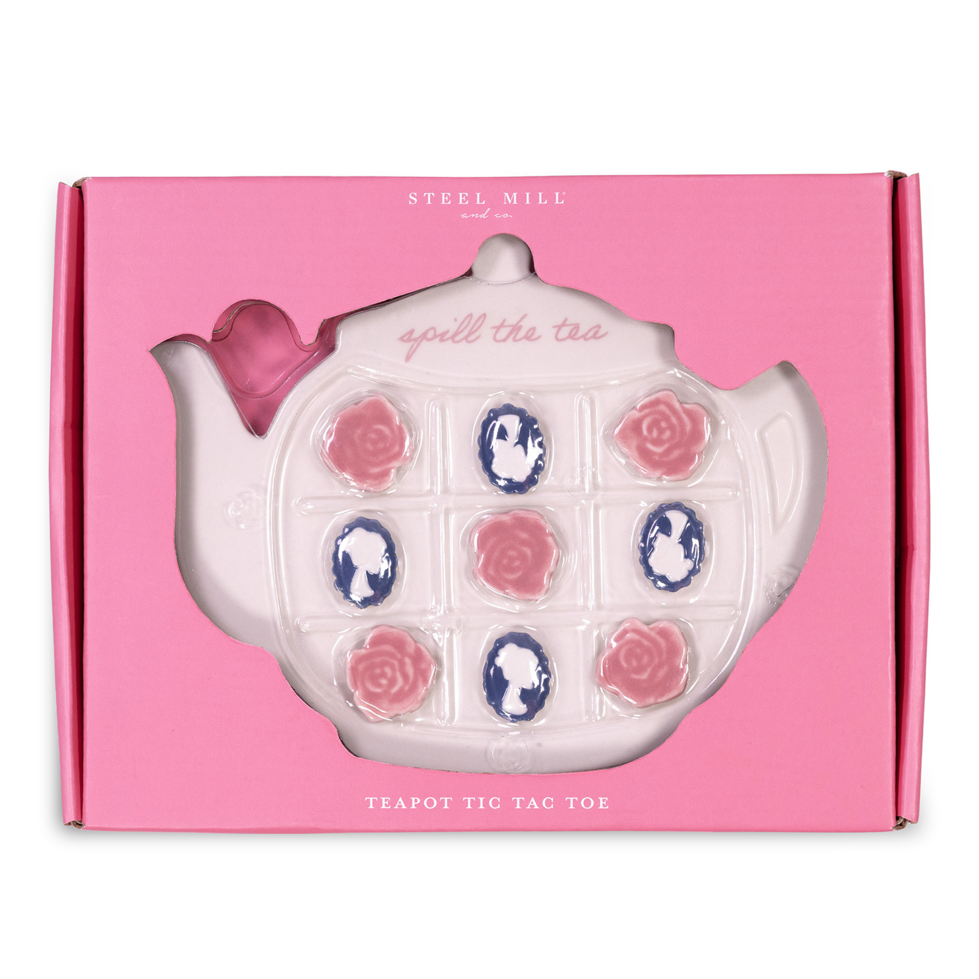 Teapot-shaped tic-tac-toe game with rose and cameo designs on a pink box, brand 'Steel Mill' visible.