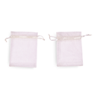 Two small white drawstring bags on a white background