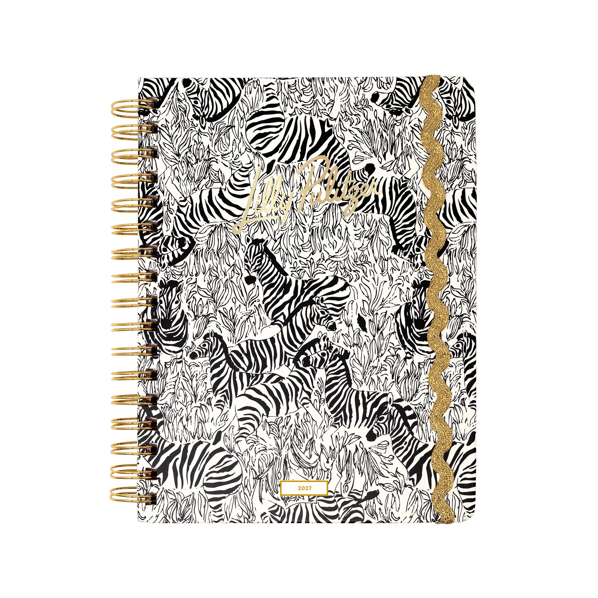 A spiral-bound planner featuring a black and white zebra print cover with gold foil accents, including a scalloped gold border and gold lettering.