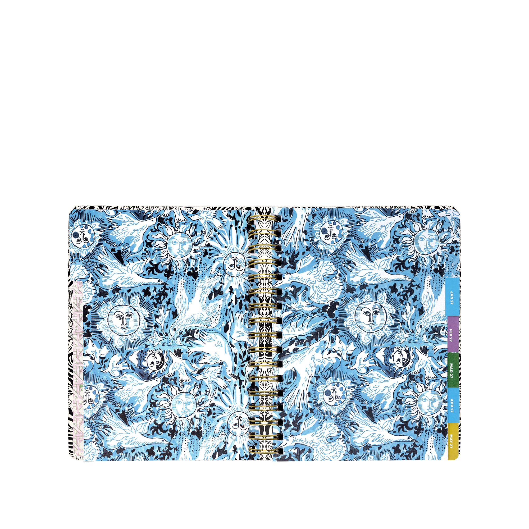 A spiral-bound planner with a detailed blue and white celestial pattern featuring suns, moons, and birds. The right edge shows colorful vertical tabs in blue, purple, green, and yellow.