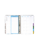 An open spiral-bound planner showing a monthly calendar layout with a 'January 2027' page, a blue 'things to do' section, weekly columns from Monday through Sunday, and colored tabs on the right side.