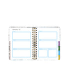 A spiral-bound weekly planner spread shown open on a white background, with labeled boxes for Monday through Sunday and a multicolor tab strip on the right edge.