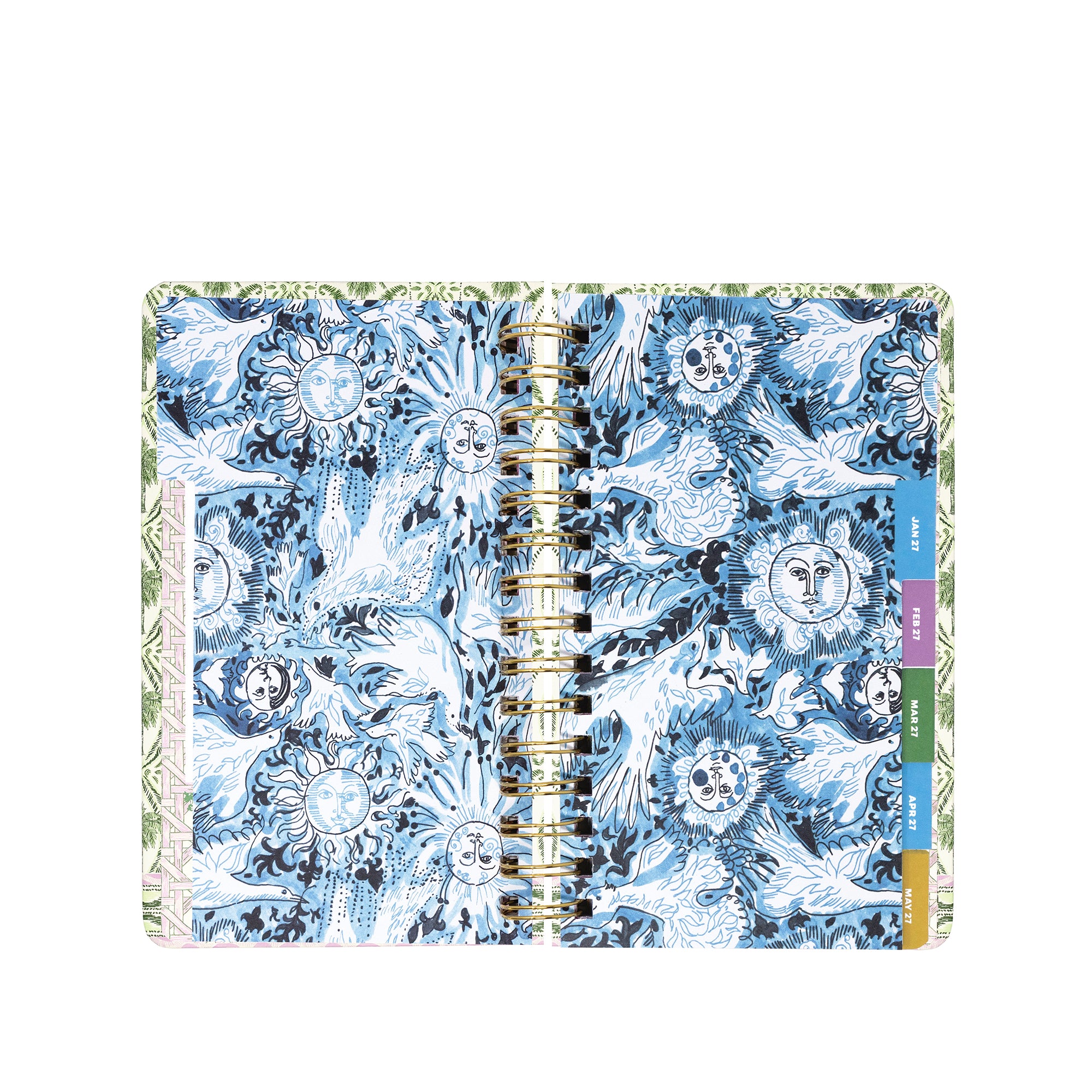 A spiral-bound planner shown open flat against a white background. The cover features an intricate blue, white, and gray sun-and-floral pattern, with a gold-tone spiral binding and colored vertical tabs on the right side.