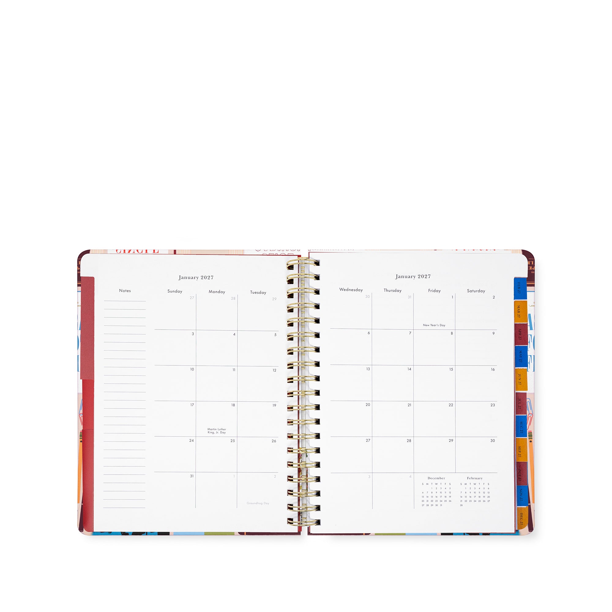 An open spiral-bound planner or calendar showing two monthly calendar spreads for January 2027, with lined daily sections on the left page and colorful tab dividers on the right, photographed on a white background.