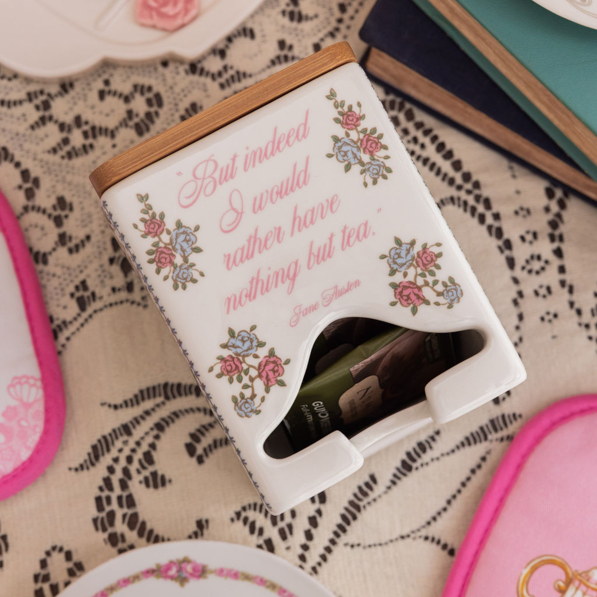 Tea bag holder with floral design and quote on a lace tablecloth