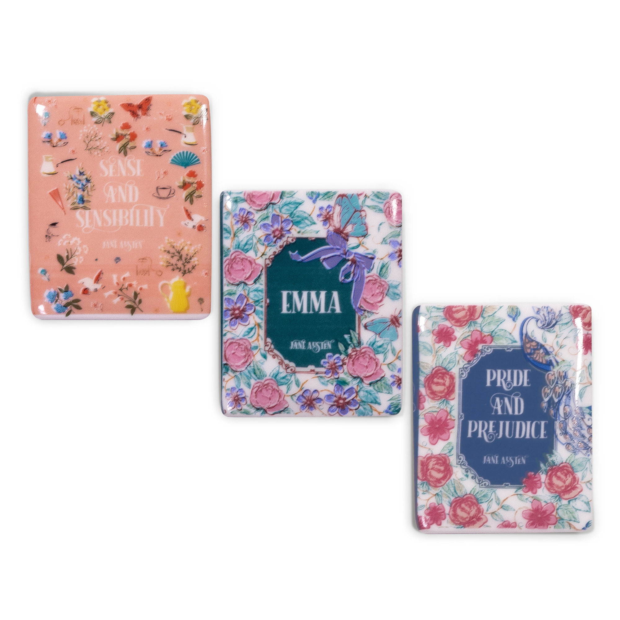 Three book-themed magnets with floral designs and book titles on a white background
