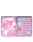 Two spiral-bound planner with colorful floral and striped designs on a white background