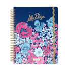 Floral notebook with gold spiral binding on a white background