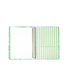 Notebook with a colorful cover and green striped pages on a white background